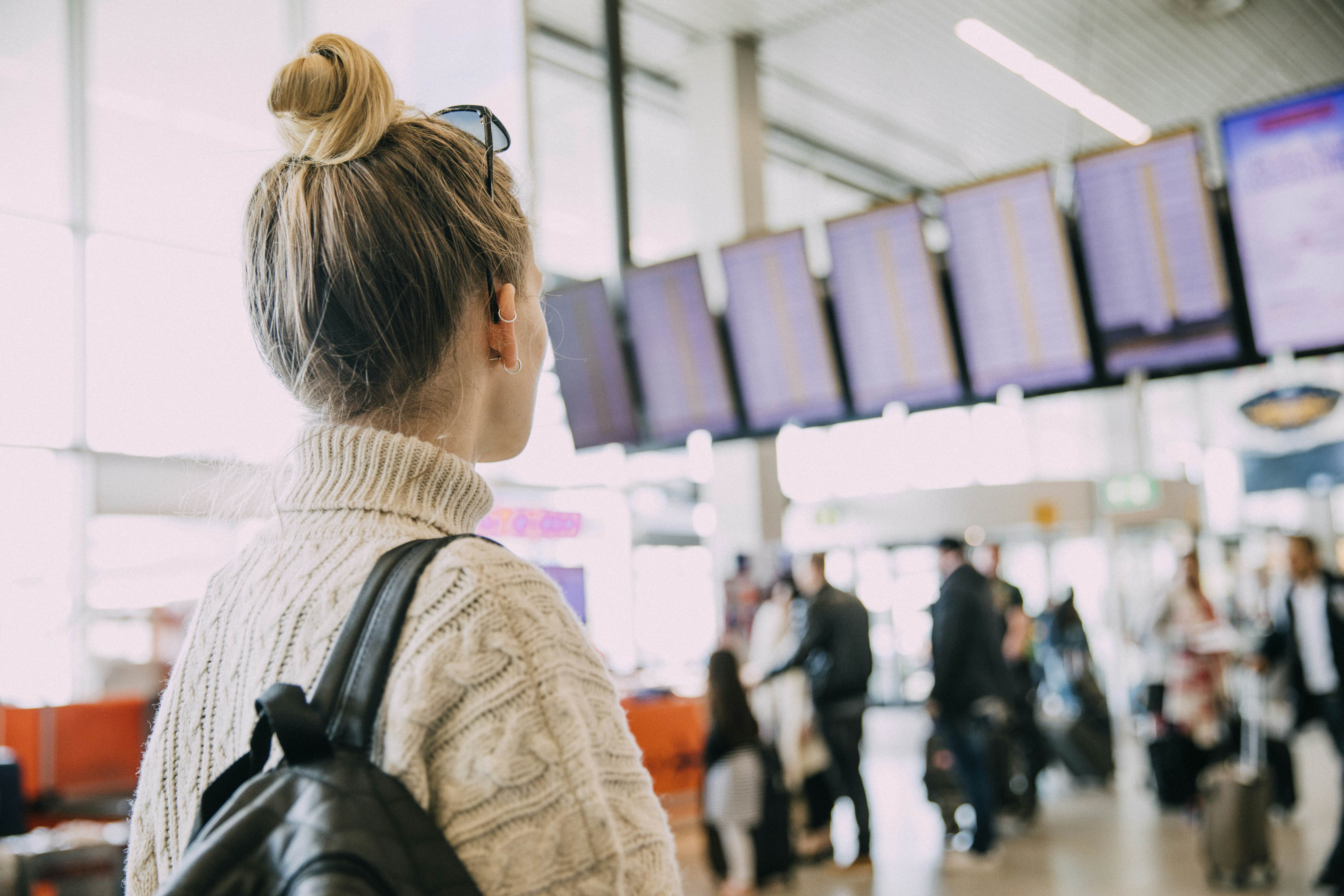 A young woman in Amsterdam waiting at the airport.
823459624